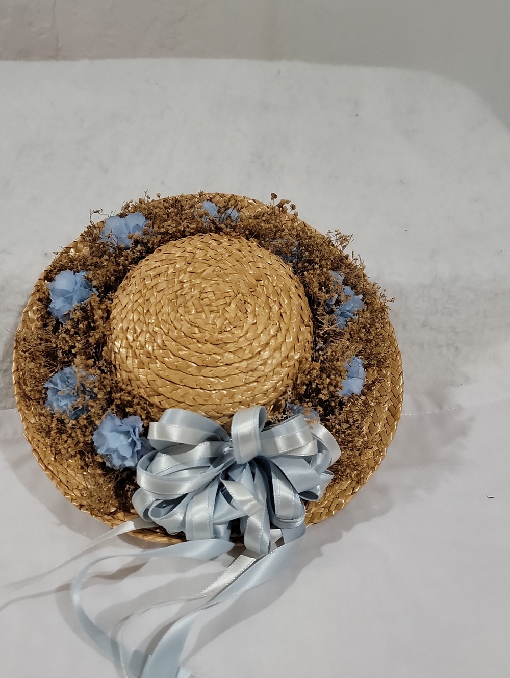 Natural Straw Decorative Hat with Light Blue Ribbon and Flower Accents